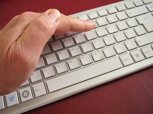 A hand hiding computer keyboard keys, but the inputs could still be seen with Van Eck phreaking.