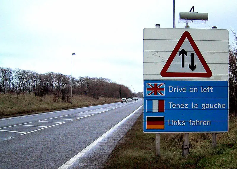 Sign telling drivers to drive on the left.