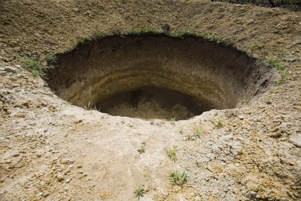 Hole illustrating a fall through the center of the earth.