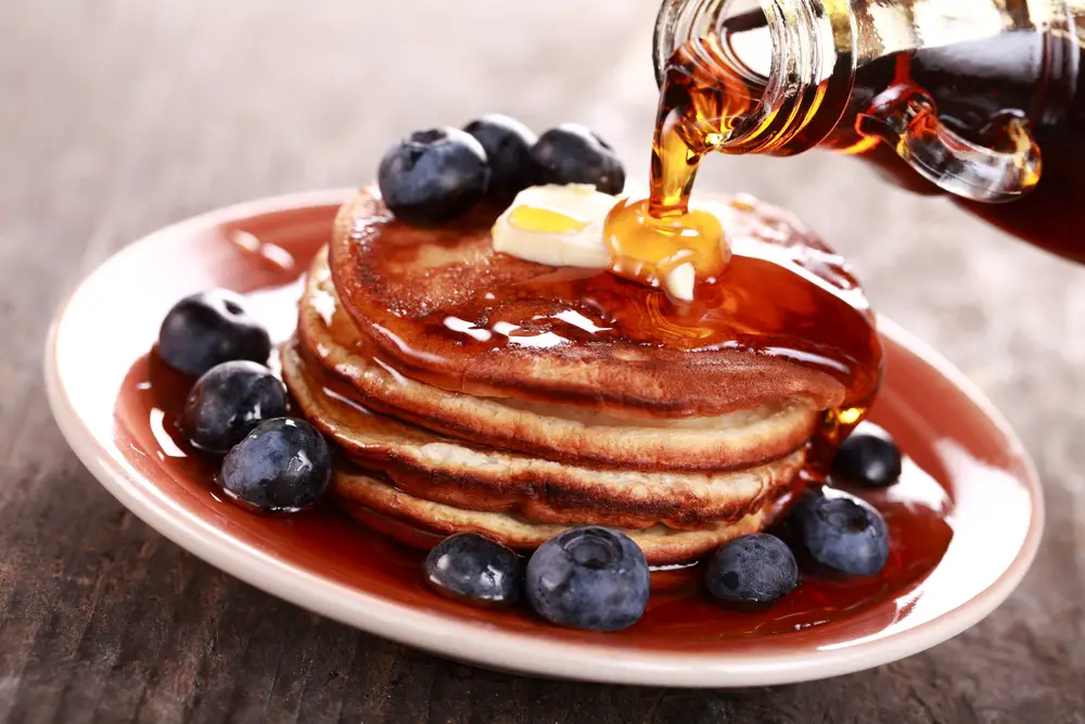 Maple syrup over pancakes.
