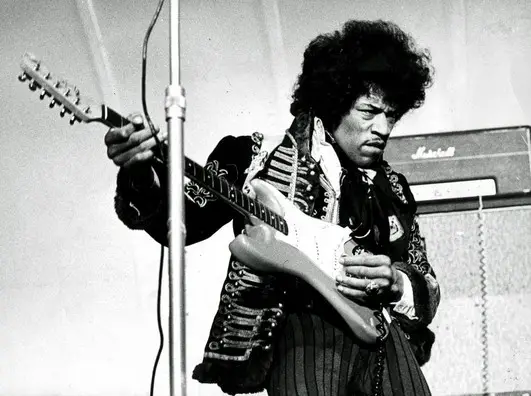 Jimi Hendrix playing the guitar